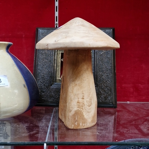 413 - A group of decorative objects, including a blue-and-cream striped glazed ceramic vase, a carved wood... 