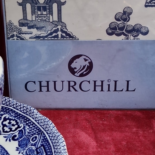 416 - A group of Churchill Blue Willow pattern blue-and-white tableware, including cups and saucers, dinne... 