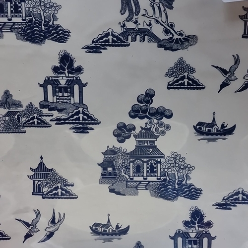 416 - A group of Churchill Blue Willow pattern blue-and-white tableware, including cups and saucers, dinne... 