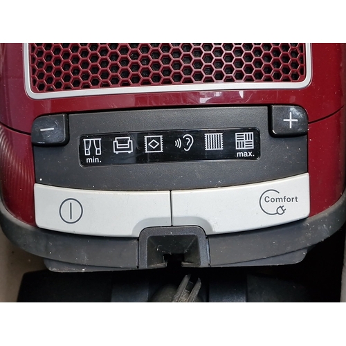 419 - A Miele Complete C3 “Cat & Dog” PowerLine canister vacuum cleaner, in maroon, with hose, telescopic ... 