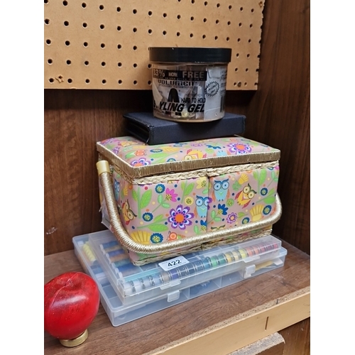 422 - A group of sewing accessories, comprising a fabric-covered sewing box with compartmented tray and as... 