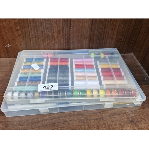 422 - A group of sewing accessories, comprising a fabric-covered sewing box with compartmented tray and as... 