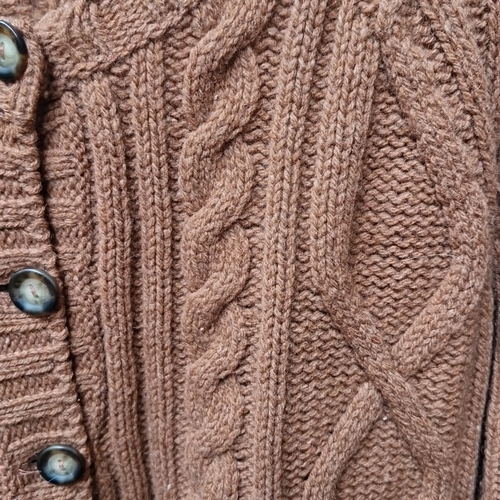 426 - A Blarney Woollen Mills Irish cable-knit wool cardigan, in rust-brown, with round neckline, long sle... 