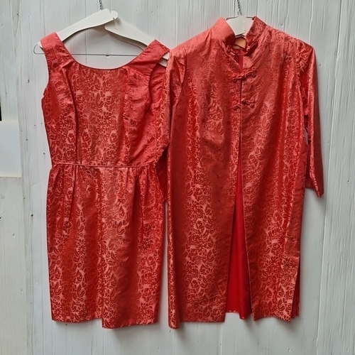 428 - 2 Chinese-style red floral brocade garments, comprising a sleeveless dress and a long jacket with ma... 