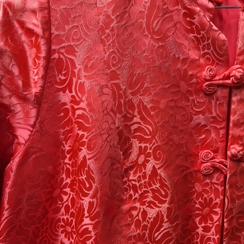 428 - 2 Chinese-style red floral brocade garments, comprising a sleeveless dress and a long jacket with ma... 