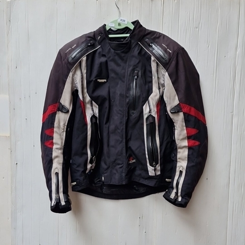 430 - A Halvarssons Malung, Sweden motorcycle jacket in black textile with grey panels and red accents, fe... 