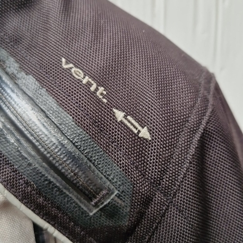 430 - A Halvarssons Malung, Sweden motorcycle jacket in black textile with grey panels and red accents, fe... 