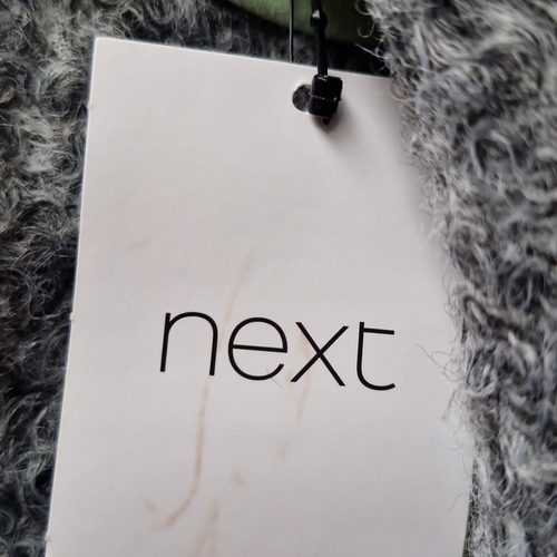 431 - A brand new Next grey bouclé overcoat, tailored with wide notched lapels and long sleeves, labelled ... 