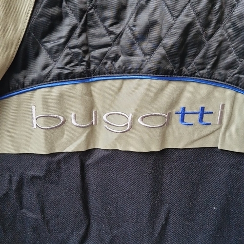 433 - A Bugatti men’s olive green coat, of concealed button front with pointed collar, long sleeves and sl... 