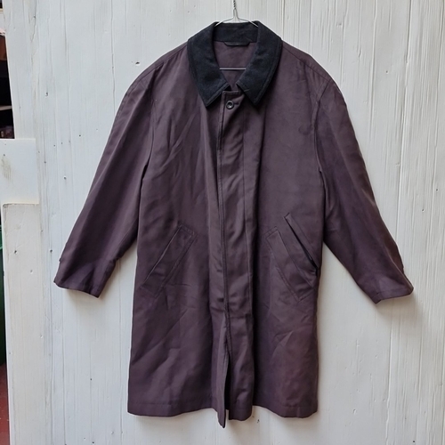 434 - A men’s dark brown coat with black collar, concealed front fastening and angled hand pockets, lined ... 