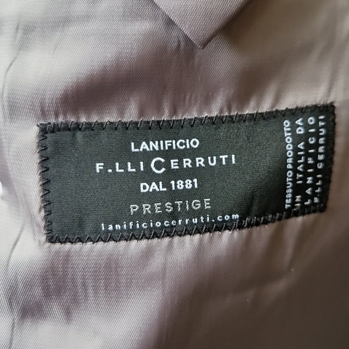 435 - A matched pair of grey tailored trousers and a single-breasted jacket, in fine Italian suiting cloth... 