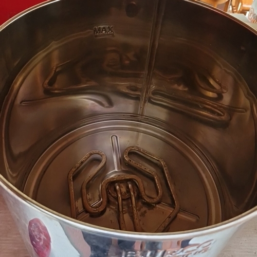 445 - A Burco Catering stainless-steel hot water urn, of cylindrical form with lidded top, integral heatin... 