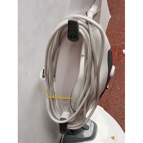 454 - A SilverCrest upright steam mop, with triangular floor head, on/off control and cord wrap, in white ... 