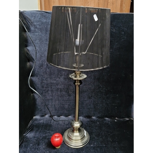 458 - A large metal table lamp with turned column and stepped circular base, fitted with a black cylindric... 
