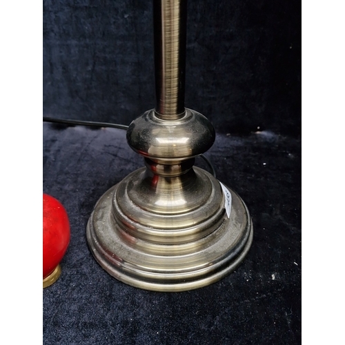 458 - A large metal table lamp with turned column and stepped circular base, fitted with a black cylindric... 