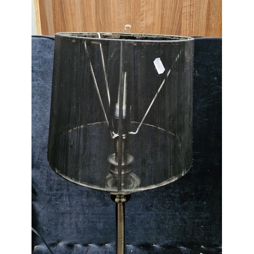 458 - A large metal table lamp with turned column and stepped circular base, fitted with a black cylindric... 