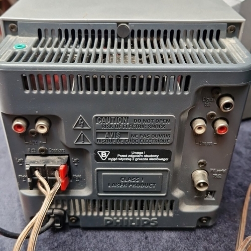 472 - A Philips compact micro hi-fi comprising a central CD receiver/amplifier unit with twin matching spe... 