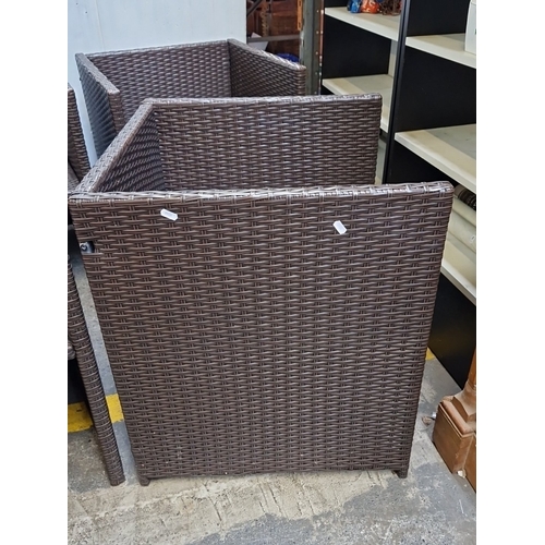 486 - A group of four contemporary garden armchairs, in brown synthetic rattan over metal frames, with squ... 