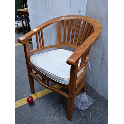496 - A bentwood armchair with wraparound horseshoe back and vertical spindle splats, upholstered seat pad... 
