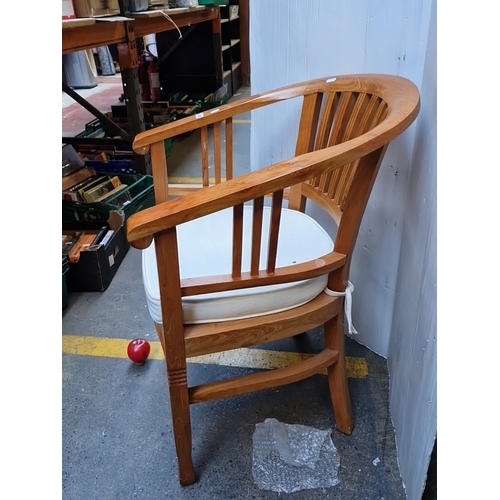 496 - A bentwood armchair with wraparound horseshoe back and vertical spindle splats, upholstered seat pad... 