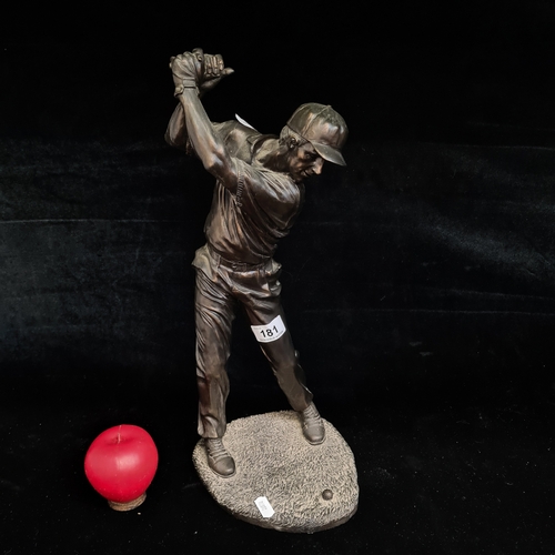 181 - A tall detailed cast bronze resin figure of a golfer mid swing. Missing club.