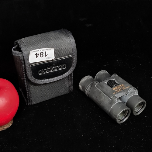 184 - A pair of Olpticron multi coated and water proof, 8x24 binoculars housed in their original nylon cas... 