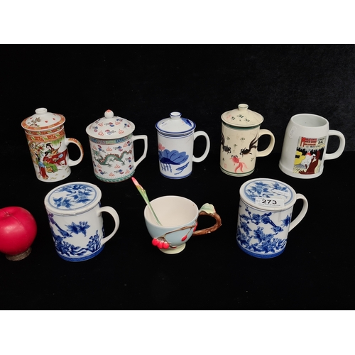 273 - A mixed selection of eight ceramic drinking cups including two lidded blue and white foliate decorat... 