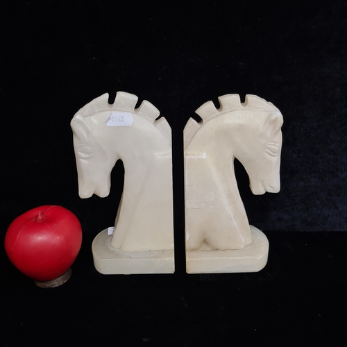 373 - A pair of Spanish alabaster horse head bookends.