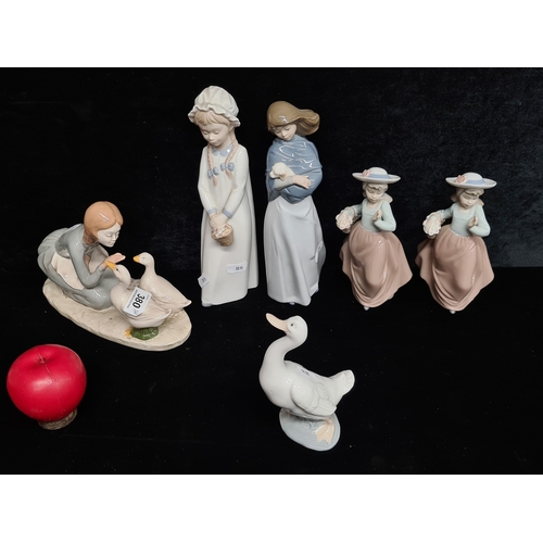 380 - A collection of six vintage porcelain figures including four Nao by Lladro, a Nadal example, and a '... 