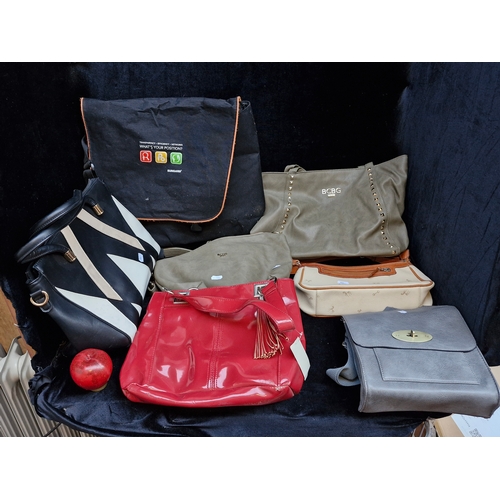 400 - Seven hand bags including a with tags studded BCBG Paris example RRP 109€, a 100% leather shoulder b... 