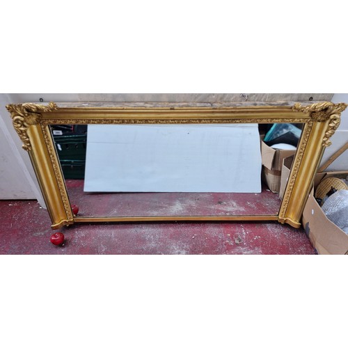 389 - Star Lot : A lovely large Antique gilt horizontal mirror with scroll , shell and foliate motifs. Dim... 