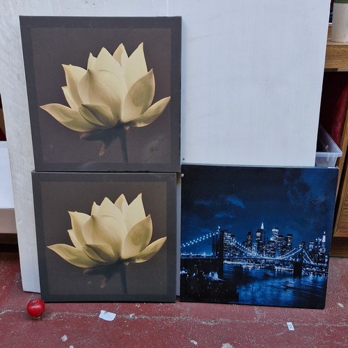 387 - Three decorative printed canvas. Lot includes a matching floral example.