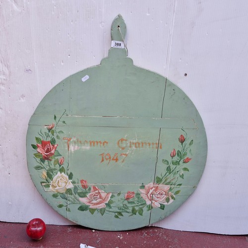 388 - A hand painted wooden sign with hand painted floral motifs and the year 1947 to face. Writing indist... 
