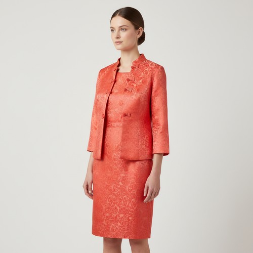 428 - 2 Chinese-style red floral brocade garments, comprising a sleeveless dress and a long jacket with ma... 