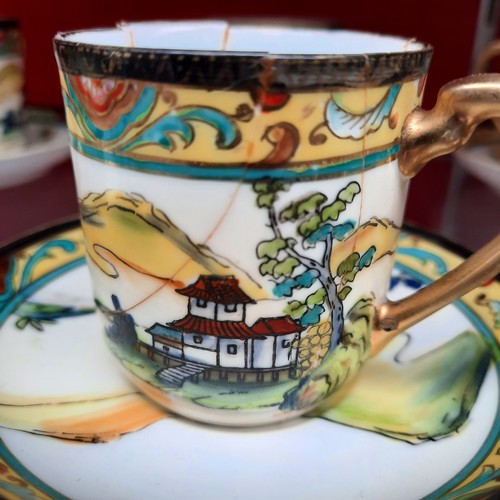 391 - A vintage Noritake porcelain tea / coffee set from Japan. Pieces feature hand painted and gilded wor... 