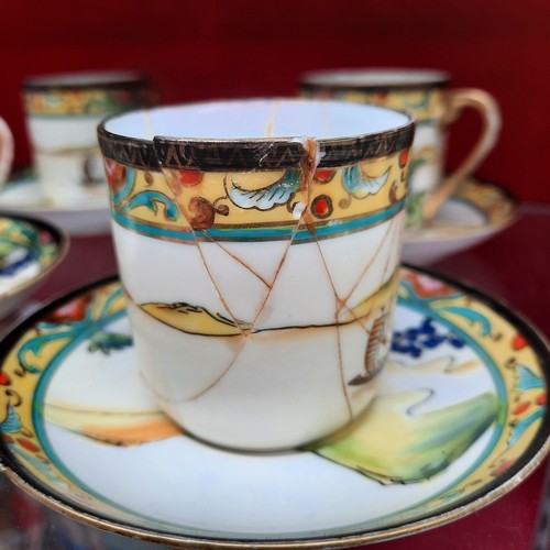 391 - A vintage Noritake porcelain tea / coffee set from Japan. Pieces feature hand painted and gilded wor... 