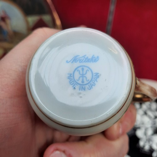 391 - A vintage Noritake porcelain tea / coffee set from Japan. Pieces feature hand painted and gilded wor... 