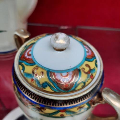 391 - A vintage Noritake porcelain tea / coffee set from Japan. Pieces feature hand painted and gilded wor... 