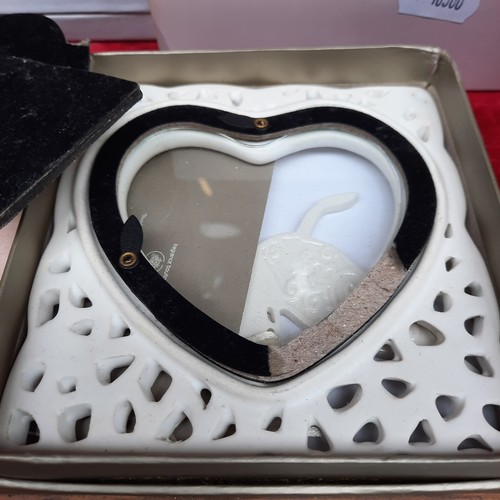 398 - A mixed lot of items including a brand new Wedgewood Christening Collection Peter Rabbit Cup, A Nost... 