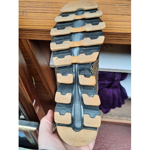 405 - A group of assorted footwear, comprising Nike Flyknit running shoes, Nike knit trainers, Adidas trai... 