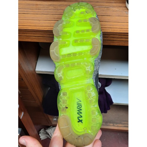 405 - A group of assorted footwear, comprising Nike Flyknit running shoes, Nike knit trainers, Adidas trai... 