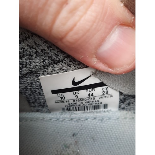 405 - A group of assorted footwear, comprising Nike Flyknit running shoes, Nike knit trainers, Adidas trai... 