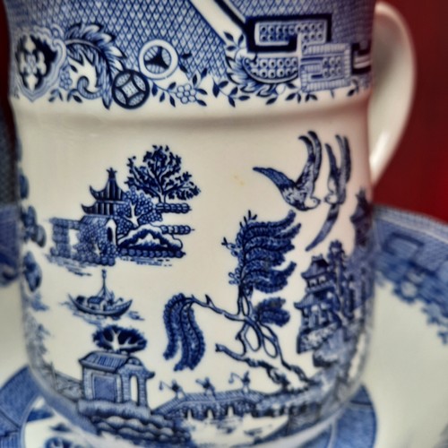416 - A group of Churchill Blue Willow pattern blue-and-white tableware, including cups and saucers, dinne... 