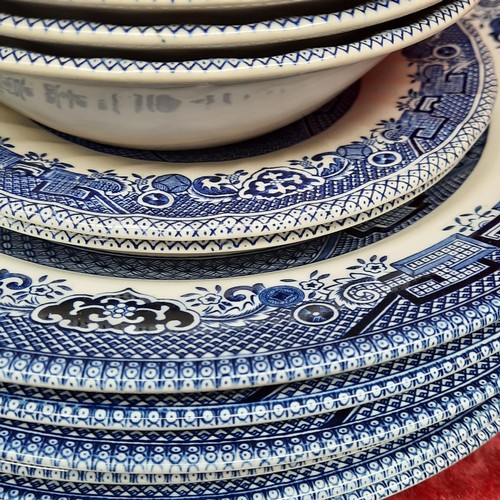 416 - A group of Churchill Blue Willow pattern blue-and-white tableware, including cups and saucers, dinne... 