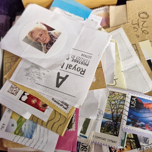 377 - A vintage stamp album, loose irish stamps on paper and a selection of 195Os letters with irish stamp... 