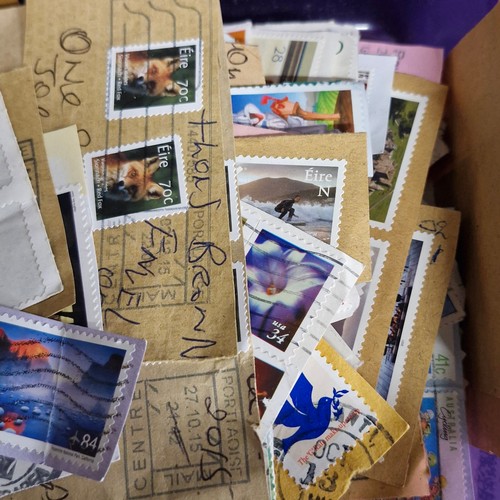 377 - A vintage stamp album, loose irish stamps on paper and a selection of 195Os letters with irish stamp... 