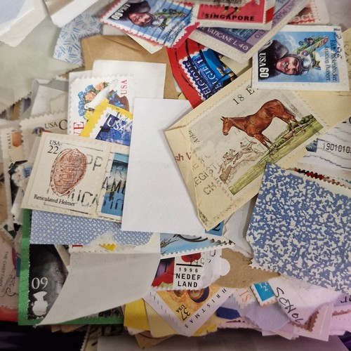 377 - A vintage stamp album, loose irish stamps on paper and a selection of 195Os letters with irish stamp... 