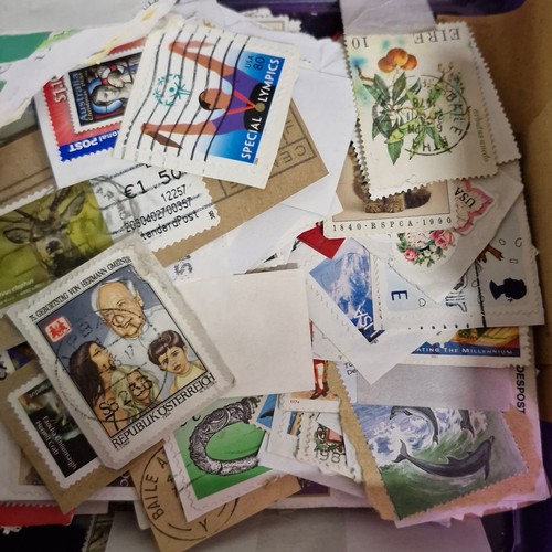 377 - A vintage stamp album, loose irish stamps on paper and a selection of 195Os letters with irish stamp... 