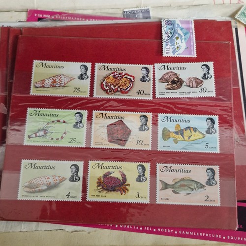 377 - A vintage stamp album, loose irish stamps on paper and a selection of 195Os letters with irish stamp... 