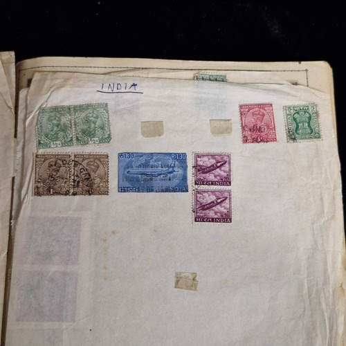 377 - A vintage stamp album, loose irish stamps on paper and a selection of 195Os letters with irish stamp... 